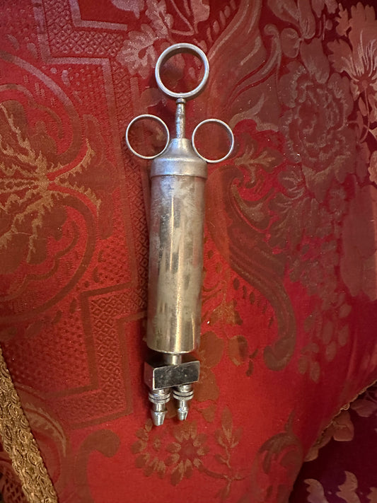 Large antique embalming syringes