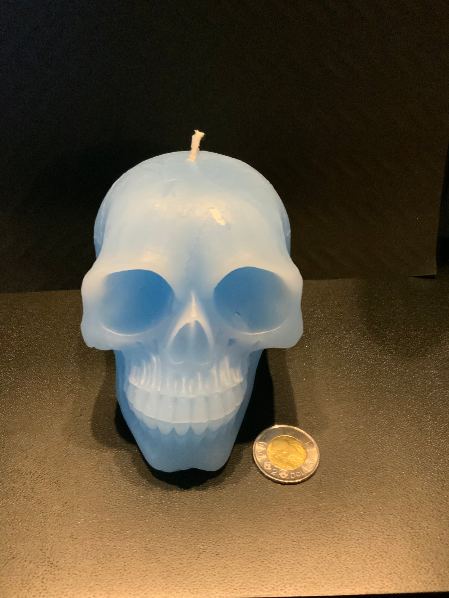 Blue human skull candle